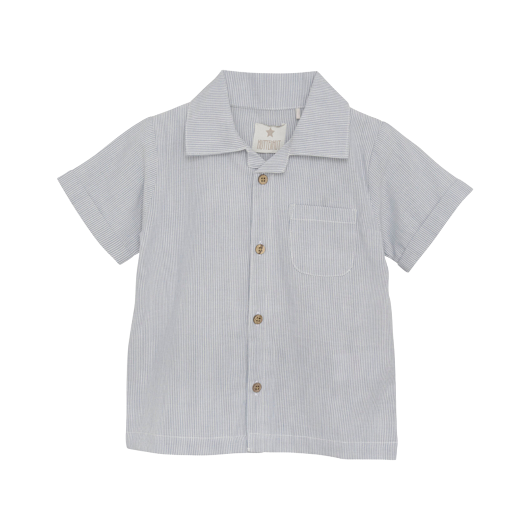 Huttelihut Button down boys shirt. Great for Polo inspired, tennis club look.Let your child make a statement in fashion while enjoying precious moments with mom. With its timeless design and impeccable quality, the Huttelihut Button Down Woven Shirt is a must-have addition to any young trendsetter's wardrobe.  free shipping to Canada and the US on orders over $100, with standard shipping rates of $6 CAD / $4.30 USD for orders below. Plus, rest assured, duties into the US are included. 