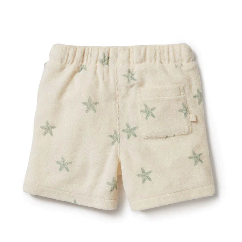 This Wilson and Frenchy terry towelling short delivers a perfect fit for summer fun. Crafted from organic fabric, it features a functional tie front, this short provides your little one with unrestricted comfort and movement all day long. Enjoy carefree playtime in style and comfort. Ships to Canada & US Duty Free.