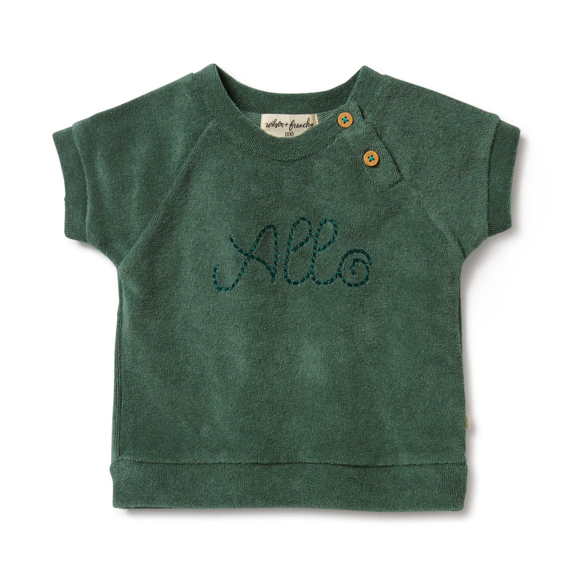 Elevate your little one's wardrobe with the adorable 'Allo' Baby Terry Cloth Green Tee from Wilson & Frenchy. Crafted with soft terry cloth fabric, this charming tee features the word 