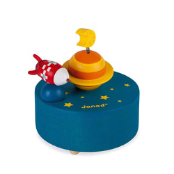 Janod A magic wooden music box! The rocket, mounted on a spring, turns around the planet to the music "In the moonlight". It will be a delight for both young and old. The winder is mechanical. This is not a toy.